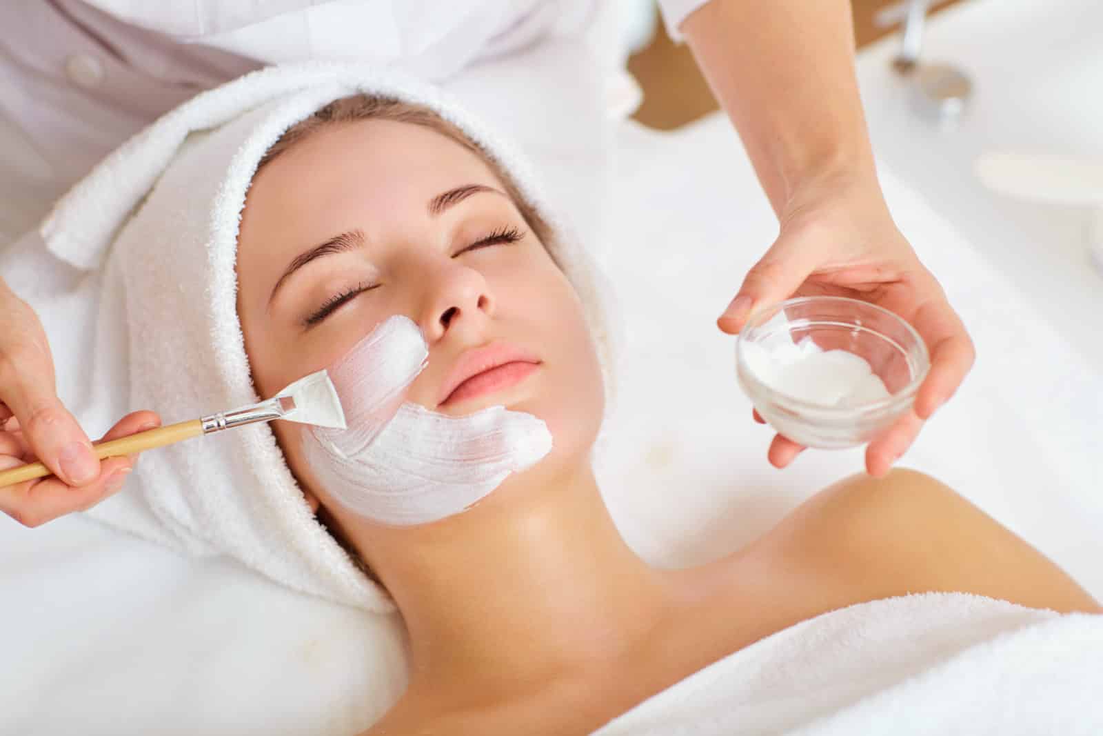 Woman in mask on face in spa beauty salon