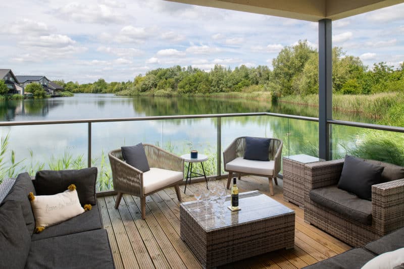 Outdoor seating area next to lake