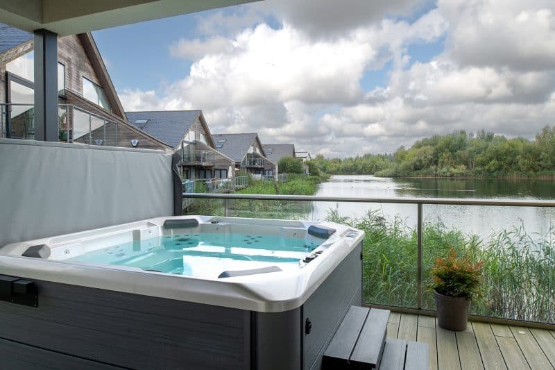 Luxurious lakeside hot tub offering stunning views across the tranquil waters.