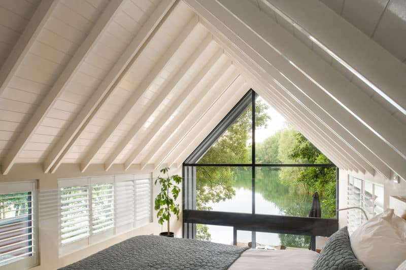 Stunning floor to ceiling windows with views of lake