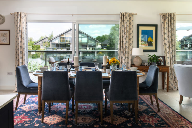 Duck House dining area with views onto the lake