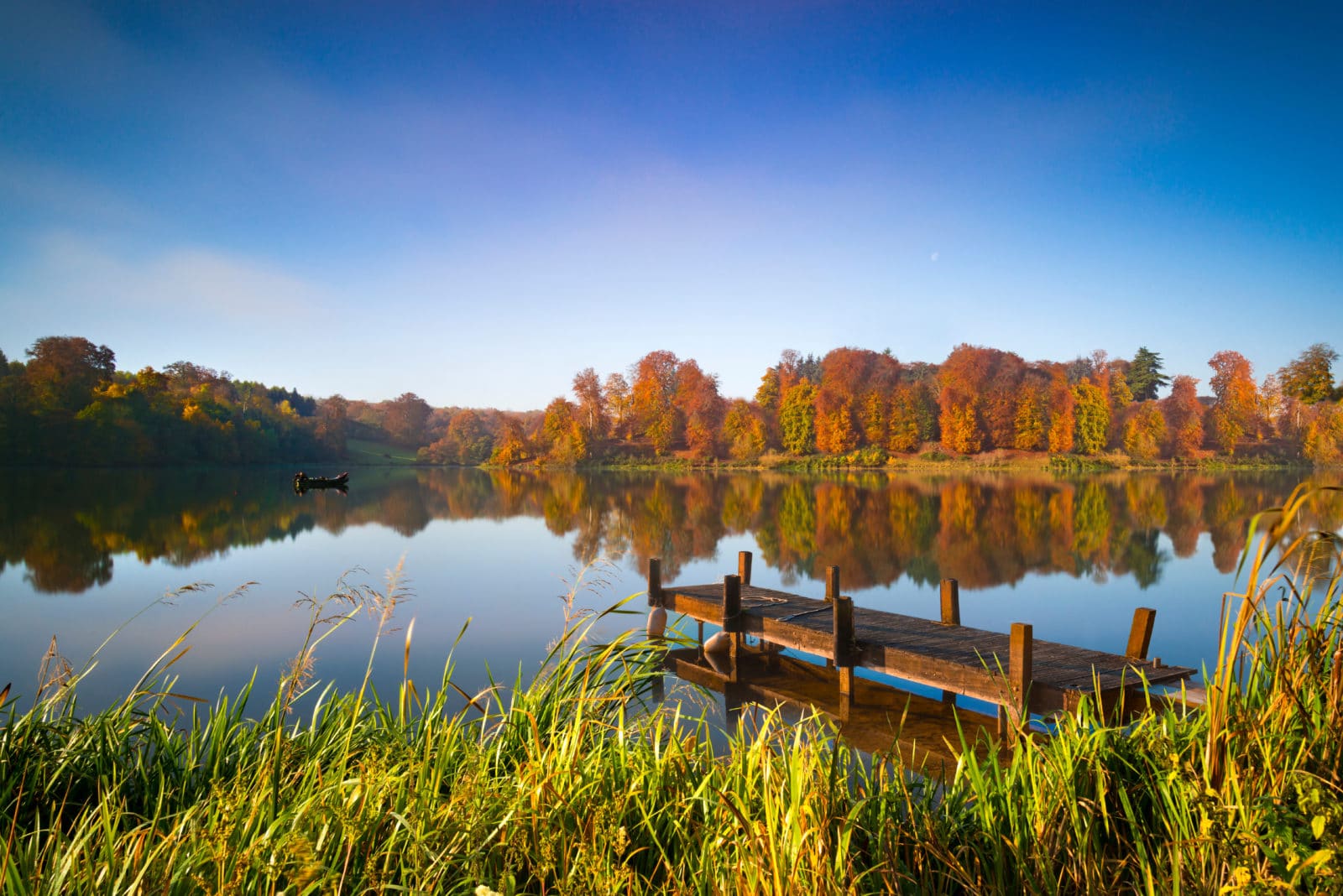 Still waters of a lake in autumn