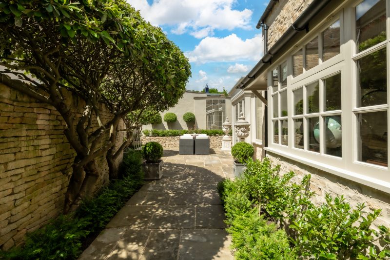 Private courtyard with original York stone flags at Courtyard Cottage