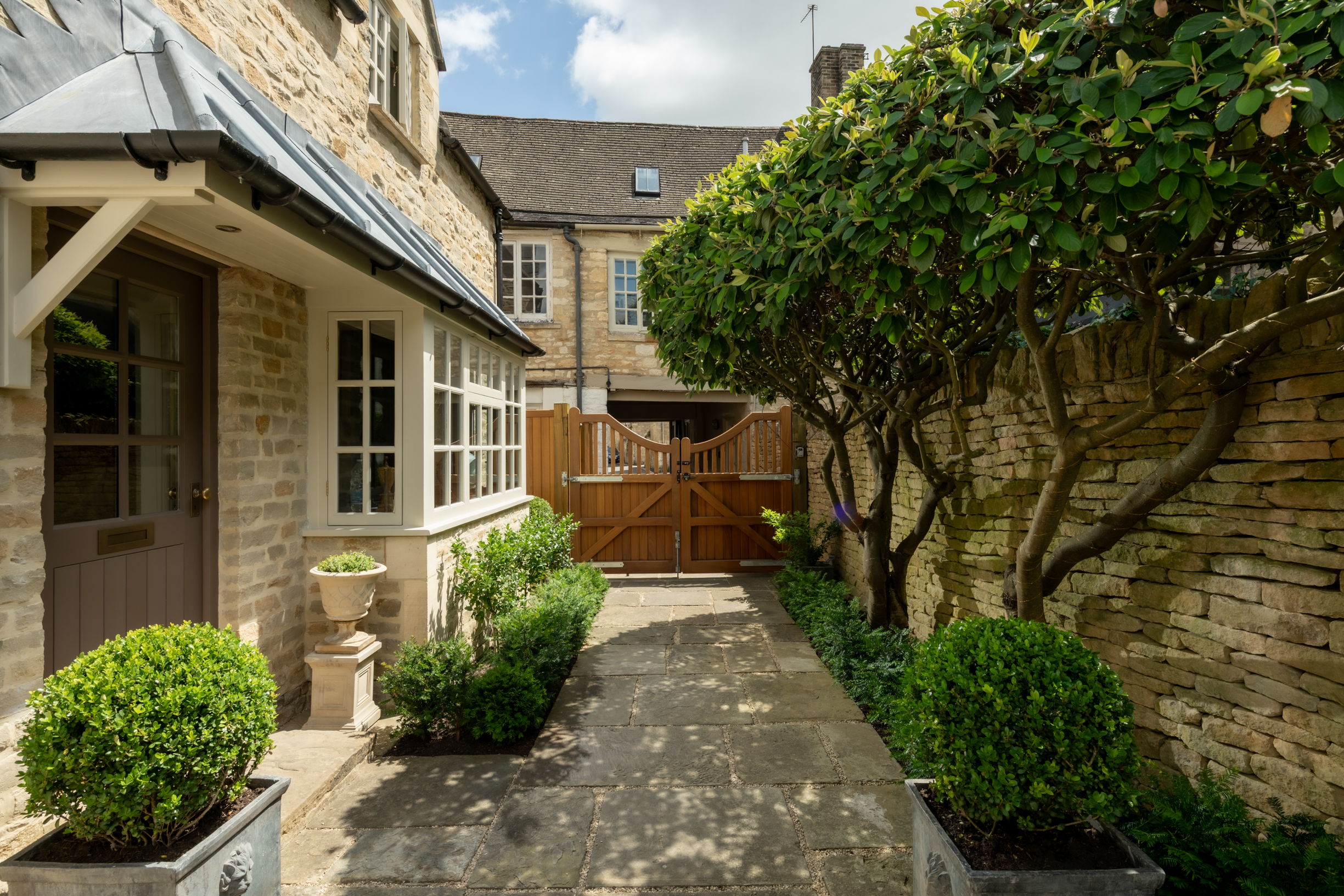 Gated entrance to Courtyard Cottage, a luxury holiday cottage in Burford