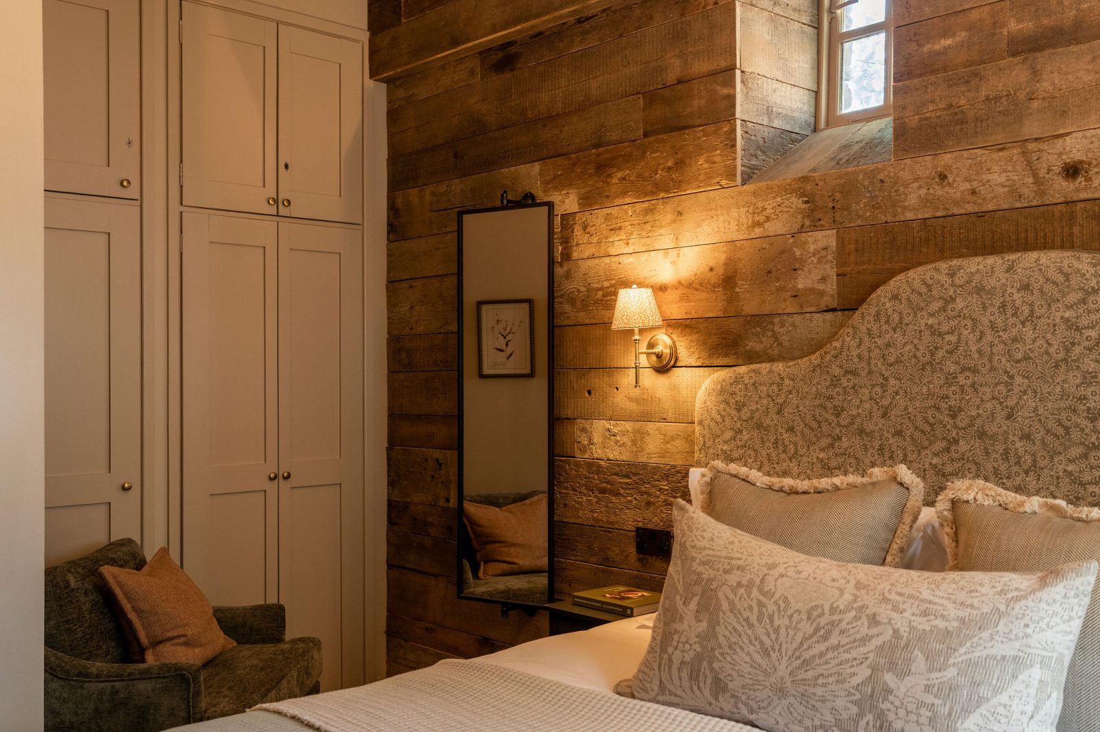 Second bedroom with soft downlighting at White Hart Cottage in the Cotswolds